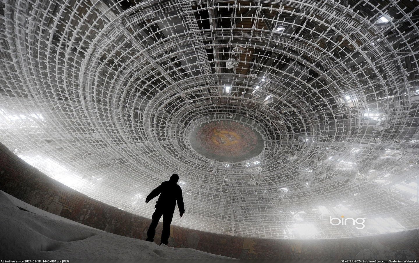 A man walks inside the crumbling skeleton of the House of the Bulgarian Communist Party on Mount Buzludzha, Bulgaria (©Getty Ima (in December 2012 HD Wallpapers)